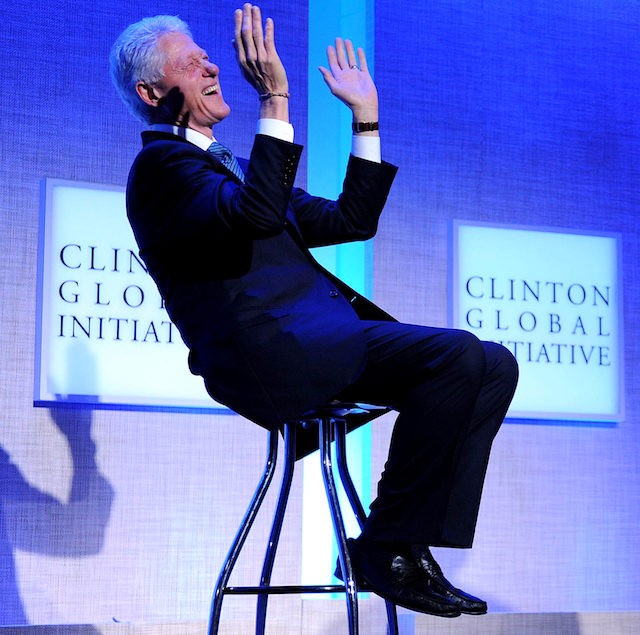 Former US President Bill Clinton laughs during remarks by President Barack Obama at the Clinton Global Initiative on September 23, 2010 at the Sheraton New York Hotel in New York City, New York. AFP PHOTO / TIM SLOAN (Photo credit should read TIM SLOAN/AFP/Getty Images)