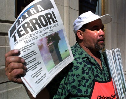 Newspaper vendor Carlos Mercado sells the "Extra" editon of the Chicago Sun-Time