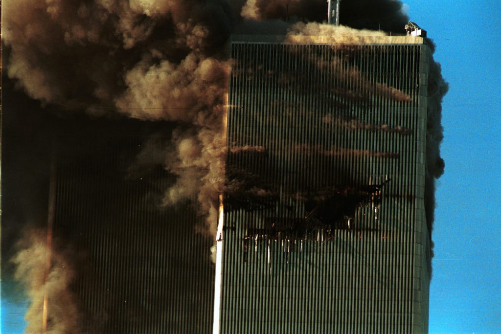 394261 109: Smoke pours from the World Trade Center after it was hit by two planes September 11, 2001 in New York City. (Photo by Robert Giroux/Getty Images)