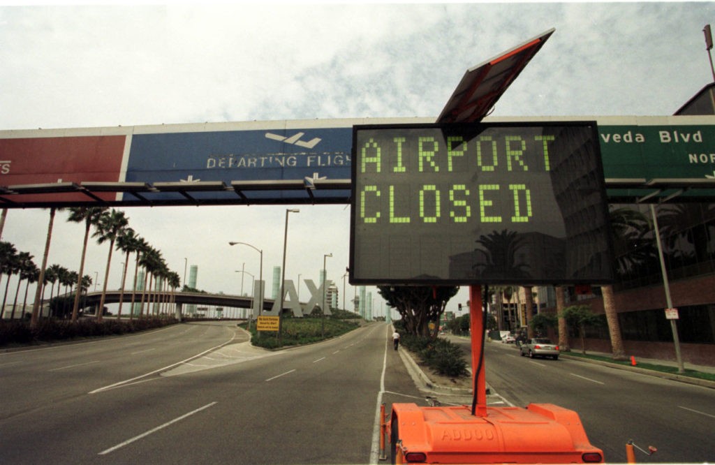 A board at the Los Angeles Airport announces the closing of the airport following an alleged coordinated terrorist attack to the World Trade Center twin towers in New York and the Pentagon in Washington DC 11 September, 2001. Some of the hijacked planes used for the attacks were heading to Los Angeles. AFP PHOTO Gerard Buckhart (Photo credit should read GERARD BURKHART/AFP/Getty Images)