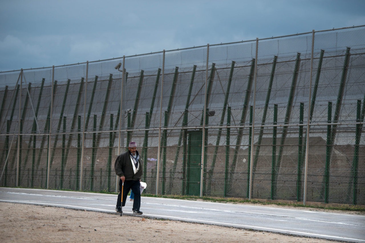 MELILLA, SPAIN - JANUARY 22: A man walks next the border fence that limits Morocco from the Spanish enclave of Melilla on January 22, 2015 in Melilla, Spain. According to Spanish Police approximately 2,400 from the 5,000 immigrants entering Melilla last year were Syrians seeking asylum in various European countries. The majority of those now housed in Temporary Immigration Centres (CETI) in Ceuta and Melilla have escaped from war in Syria. According to the last official figures released by the Spanish Authorities, 1,300 immigrants are living at the Temporary Immigration Centre of Melilla, four times its capacity of 480 people. About 840 Syrian refugees are among them outnumbering Sub-Sahara immigrants for the first time since these camps were built. (Photo by David Ramos/Getty Images)