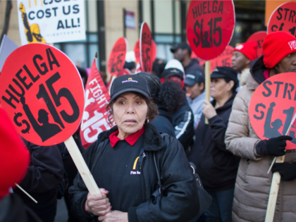 Latino and African-American workers campaign for a $15 minimum wage.