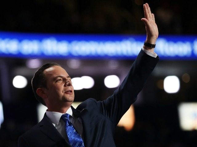 Reince Priebus, chairman of the Republican National Committee, waves to the crowd after de