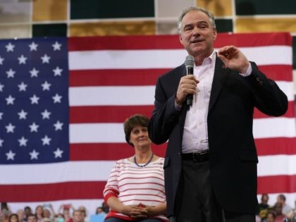 Democratic vice presidential candidate Sen. Tim Kaine (D-VA) (R) speaks to voters as his w