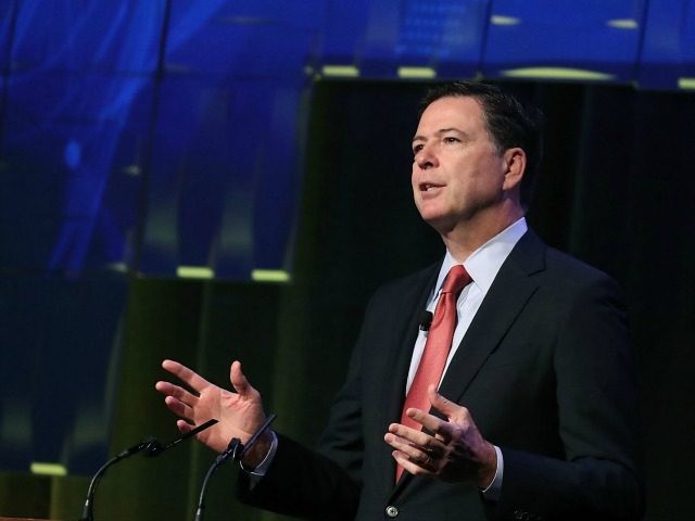 FBI Director James Comey speaks during a government symposium on cyber security, on August