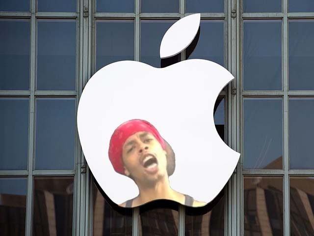 The Apple logo is seen on the outside of Bill Graham Civic Auditorium before the start of