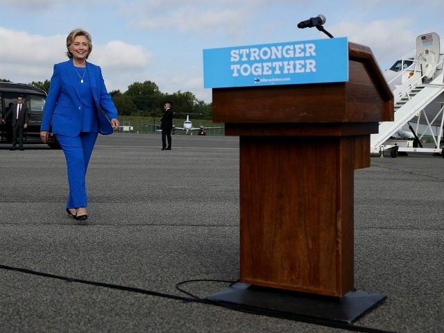 Democratic presidential nominee former Secretary of State Hillary Clinton walks to a podiu