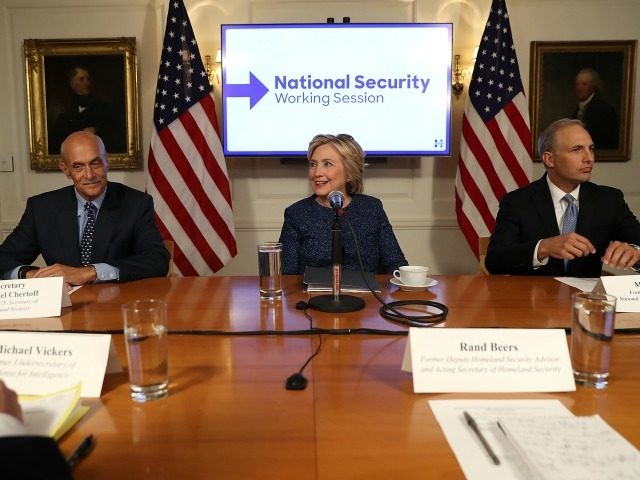 Hillary Clinton (C) meets with national security advisors during a National Security Worki