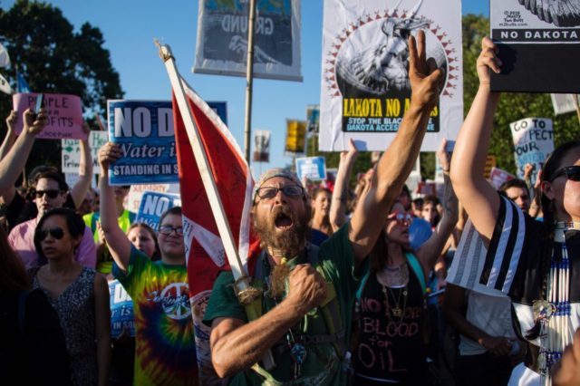 Demonstrators chant as they gather in front of the White House in Washington, DC, on September 13, 2016, to protest the Dakota Access Pipeline. The US government on September 9, 2016 sought to stop work on a controversial oil pipeline in North Dakota that has angered Native Americans, blocking any …