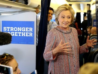 Hillary Clinton speaks to members of the traveling press aboard her campaign plane September 15, 2016 in White Plains, New York.