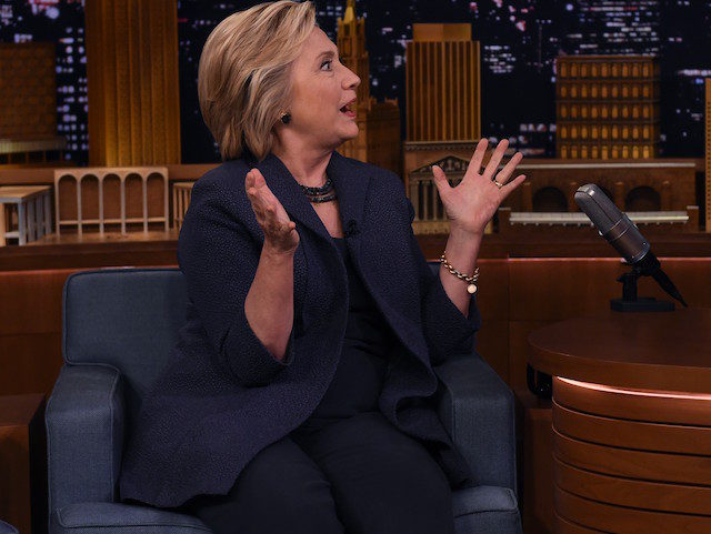 US Democratic presidential nominee Hillary Clinton speaks with talk show host Jimmy Fallon