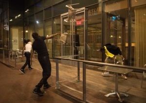 Protesters throw chairs at a restaurant during a demonstration against police brutality in Charlotte, North Carolina, on September 21, 2016, following the shooting of Keith Lamont Scott the previous day. Violence broke out in Charlotte, North Carolina for a second night as police braced for a repeat of confrontations ignited by the fatal police shooting of a black man. (NICHOLAS KAMM/AFP/Getty Images)