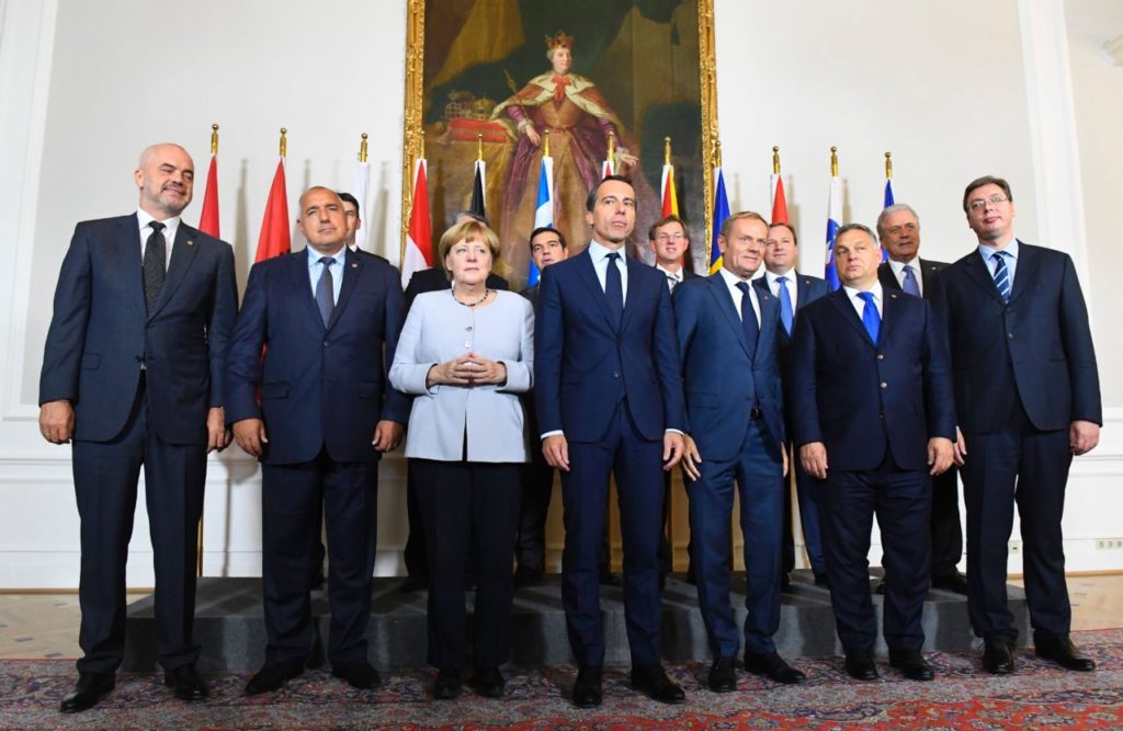(Back row, L to R) Romania's Foreign Minister Dragos Tudorache, Croatian Prime Minister Tihomir Oreskovic, Greece's Prime Minister Alexis Tsipras, Slovenian Prime Minister Miro Cerar, Macedonian Prime Minister Emil Dimitriev and EU commissioner Dimitris Avramopoulos, (front row, L to R) Albania's Prime Minister Edi Rama, Bulgaria's Prime minister Boyko Borissov, German chancellor Angela Merkel, Austrian chancellor Christian Kern, European Council President Donald Tusk, Hungarian Prime Minister Viktor Orban and Serbia's prime minister Aleksandar Vucic pose for a family photo after a meeting on the Balkan migrant route into the EU in Vienna on September 24, 2016. / AFP / JOE KLAMAR (Photo credit should read JOE KLAMAR/AFP/Getty Images)