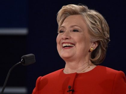 Democratic nominee Hillary Clinton smiles during the first presidential debate at Hofstra University in Hempstead, New York on September 26, 2016. / AFP / Paul J. Richards (Photo credit should read PAUL J. RICHARDS/AFP/Getty Images)