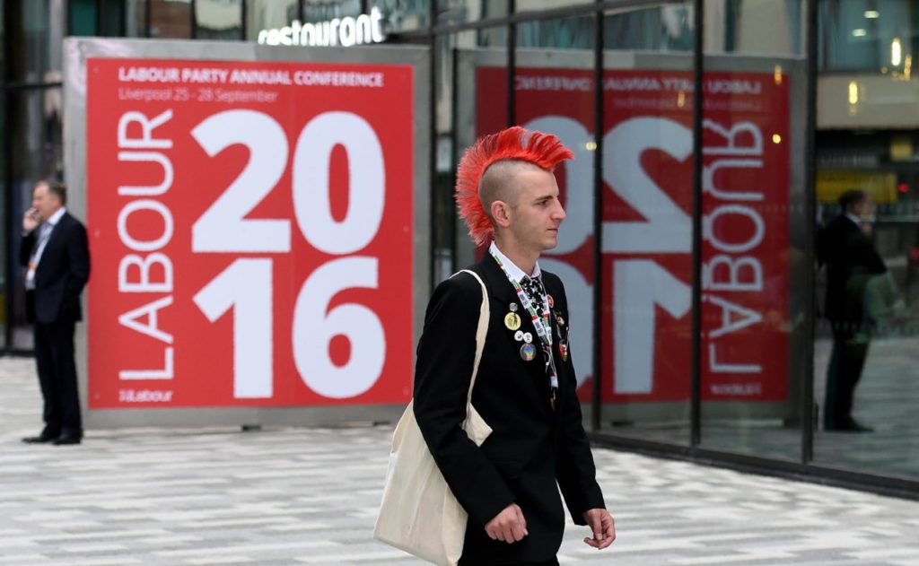 A delegate arrives for the third day of annual Labour Party conference in Liverpool, north west England on September 27, 2016. Distracted by a bitter leadership contest, Britain's main opposition Labour party has struggled to present a vision of Brexit to challenge the ruling Conservatives -- and many fear the re-election of Jeremy Corbyn will do little to change this. / AFP / PAUL ELLIS (Photo credit should read PAUL ELLIS/AFP/Getty Images)