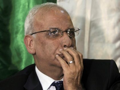 Saeb Erekat, Chief Palestinian negotiator, gestures during a press conference in Jerusalem on March 19, 2015. The Palestine Liberation Organisation (PLO) executive committe was given two weeks to work out the modalities to end the security cooperation with Israel, Erekat said. AFP PHOTO / AHMAD GHARABLI (Photo credit should read …