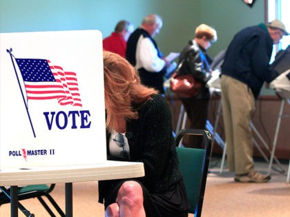A steady stream of voters fill the voting booths at Ronald Reagan Lodge, Tuesday, Nov. 6, 2012, in West Chester, Ohio. (AP Photo/Al Behrman)