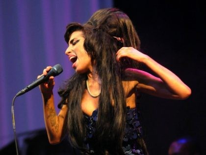 GLASTONBURY, UNITED KINGDOM - JUNE 28: Amy Winehouse performs on the Pyramid stage during day two of the Glastonbury Festival at Worthy Farm, Pilton on June 28, 2008 in Glastonbury, Somerset, England. (Photo by Jim Dyson/Getty Images)