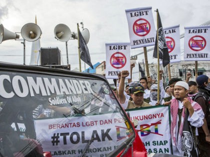 YOGYAKARTA, INDONESIA - FEBRUARY 23: Anti-LGBT activists protest on February 23, 2016 in Yogyakarta, Indonesia. Indonesia ministers and religious leaders have taken additional steps to denounced homosexuality, LGBT websites had been blocked and hardliners launched anti-gay raids over recent weeks. Indonesia saw its former communications minister calling for the public …