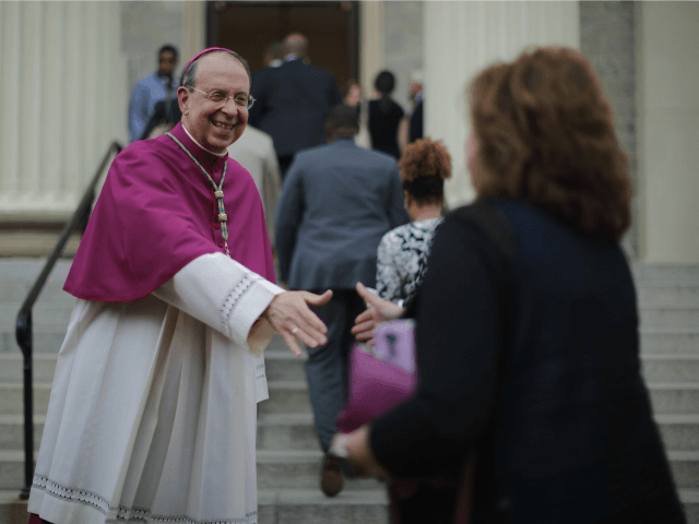 BALTIMORE, MD - APRIL 25: Catholic Archbishop of Baltimore William Lori (L) welcomes peopl