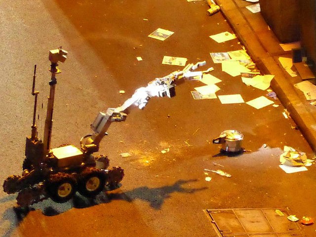 NEW YORK, NY - SEPTEMBER 17: A NYPD bomb disposal robot handles an unexploded pressure coo