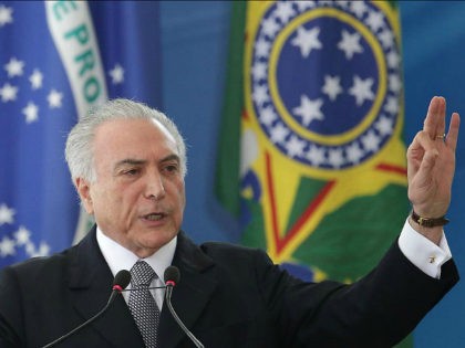 Brazil's President Michel Temer speaks during a ceremony, at the Planalto Presidential Palace, in Brasilia, Brazil, Wednesday, Sept. 14, 2016. Temer has rubbed elbows with world leaders in China, been vociferously booed at important national events and signaled he will move forward with unpopular reforms, such as trimming pension benefits. …