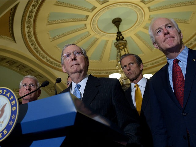 FILE - In this Sept. 13, 2016 file photo, Senate Majority Leader Mitch McConnell of Ky., second from left, standing with, from left, Sen. Roger Wicker, R-Miss., Sen. John Thune, R-S.D., and Senate Majority Whip John Cornyn, of Texas, listens to a question during a news conference on Capitol Hill …