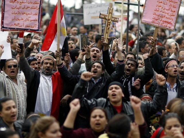 Egyptian Coptic Christians chant slogans during a demonstration outside the state televisi