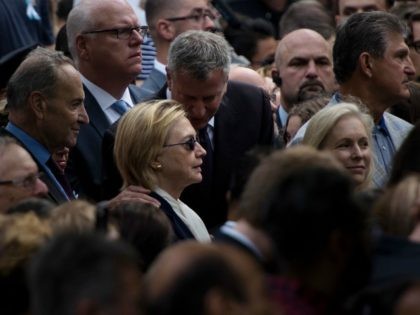 New York City Mayor Bill de Blasio speaks to US Democratic presidential nominee Hillary Clinton during a memorial service at the National 9/11 Memorial September 11, 2016 in New York. The United States on Sunday commemorated the 15th anniversary of the 9/11 attacks. / AFP / Brendan Smialowski (Photo credit …