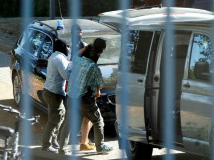 German special police forces escort a Syrian suspected of being &hellip;