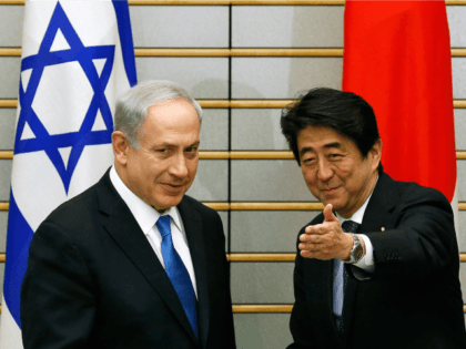 Israel's Prime Minister Benjamin Netanyahu (L) meets with Japan's Prime Minister Shinzo Abe at the start of their meeting at the prime minister's official residence in Tokyo on May 12, 2014. AFP PHOTO / POOL / Toru Hanai (Photo credit should read TORU HANAI/AFP/Getty Images)