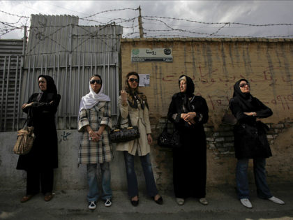 Iranian women wait in line outside a polling station during the Iranian presidential election in Tehran, in this June 12, 2009 file photo. REUTERS/Ahmed Jadallah/Files