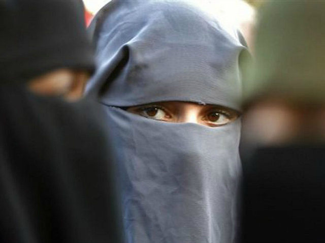 Protestors demonstrate against the ban on Muslim women wearing the burqa in public in The