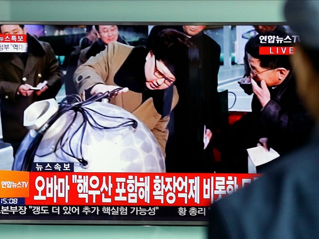 A South Korean man watches a TV news program showing North Korean leader Kim Jong Un, at S