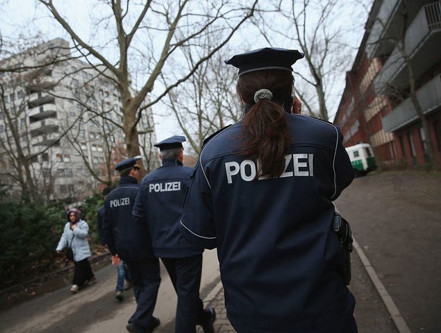 BERLIN, GERMANY - JANUARY 27: Police walk outside the the Central Registration Office for