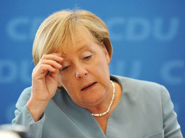 German Chancellor Angela Merkel arrives for a party leadership meeting of the Christian Democratic Union (CDU) in Berlin on August 23, 2010. Chancellor Angela Merkel dismissed angry calls by German business leaders to scrap a planned tax on nuclear energy production which they call a threat to investment. AFP PHOTO …
