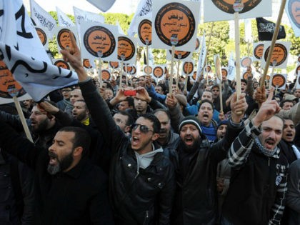TUNISIA, Tunis : Tunisian protesters shoot slogans during a demonstration called by the su