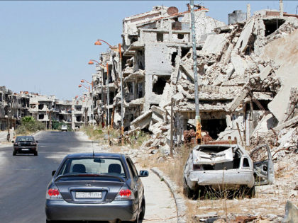 Damaged buildings and rubble line a street in Homs, Syria, Sept. 19, 2016. Syria’s military command has declared the U.S-Russian brokered cease-fire over, blaming the rebel groups for undermining it. In a statement Monday, the Syria military said “the armed terrorist groups” repeatedly violated the cease-fire which came into effect …
