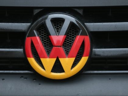 BERLIN, GERMANY - DECEMBER 17: A Volkswagen logo and hood ornament in the colors of the German flag is visible on the front grille of a car on December 17, 2015 in Berlin, Germany. Volkswagen is continuing to struggle with the consequences of its emissions cheating scandal, in which the …