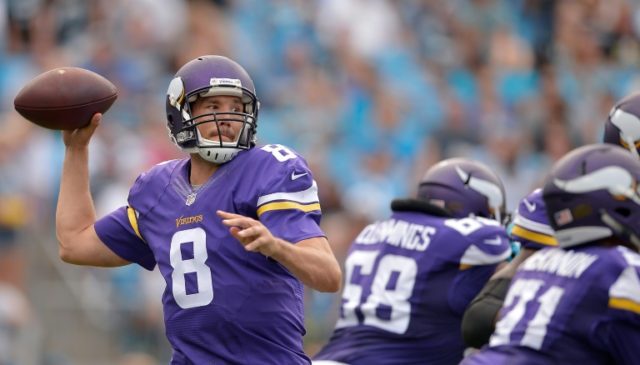 Sam Bradford of the Minnesota Vikings throws a pass during their NFL game against the Caro