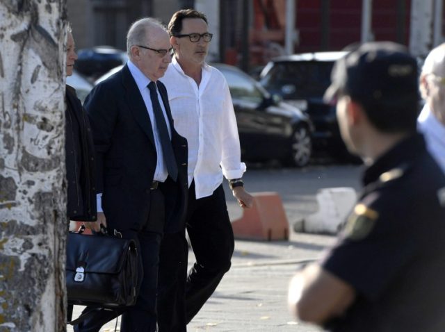 Former IMF chief Rodrigo Rato (left) arrives at the Spanish courthouse in San Fernando de
