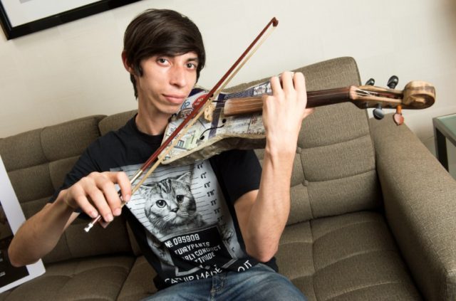 Violinist William Wilson Lopez the Recycled Orchestra of Cateura, Paraguay, poses for a ph
