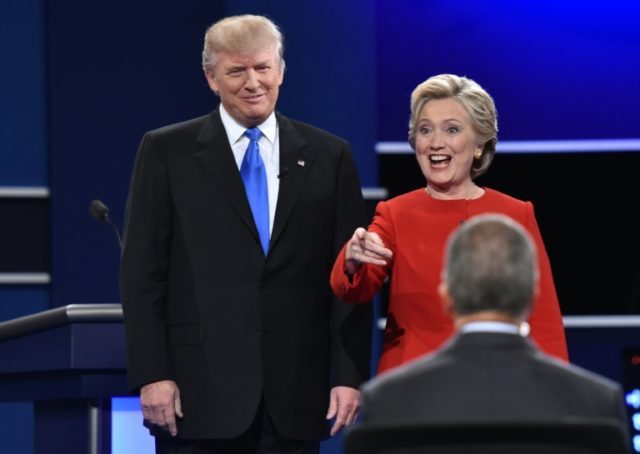 Democratic nominee Hillary Clinton (R) and Republican nominee Donald Trump attend the firs
