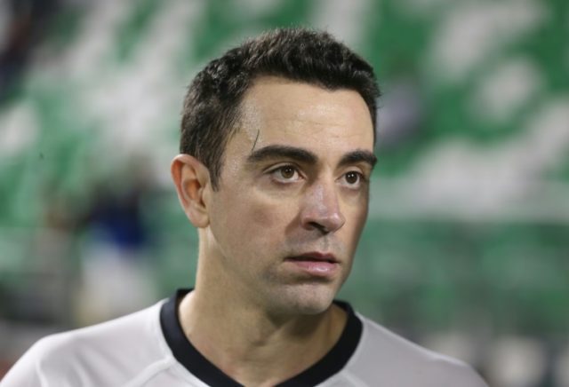 Qatari Al-Sadd club's Xavi Hernandez (L) of Spain during the Sheikh Jassim Cup final footb