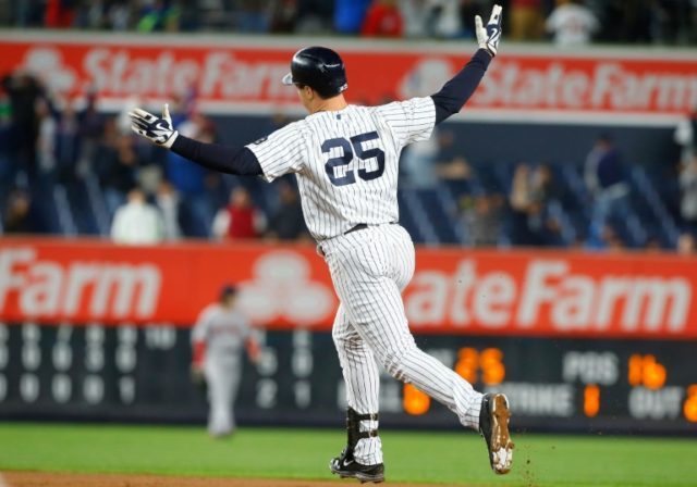 Mark Teixeira of the New York Yankees celebrates his game winning ninth inning grand slam