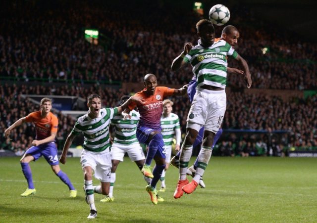 Manchester City's Brazilian midfielder Fernando (R) vies in the air with Celtic's French s