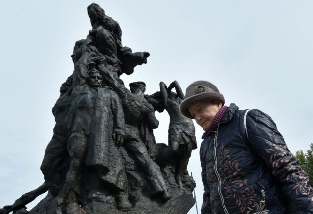 Survivor Raisa Maistrenko visits the Babi Yar monument in Kiev as Ukraine prepares to mark