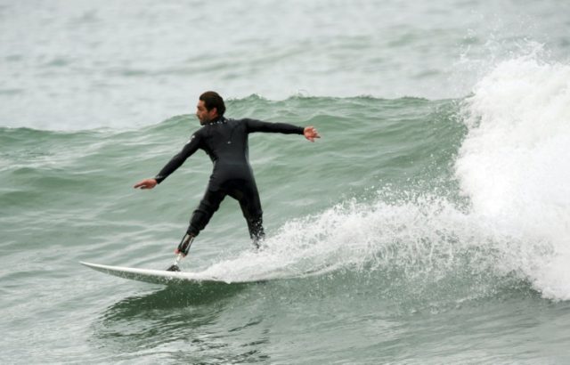 Eric Dargent surfs on Lafitenia beach in Saint-Jean de Luz, southwestern France on Septemb