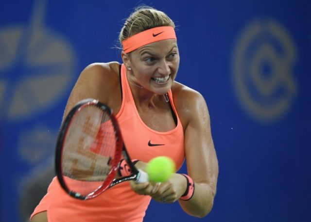Petra Kvitova of the Czech Republic hits a return during her semi-final against Simona Hal