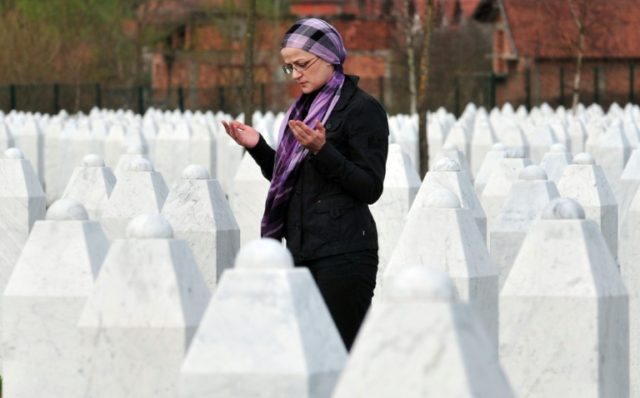 A Bosnian Muslim woman at Potocari memorial cemetery near Srebrenica where 8,000 Muslim me